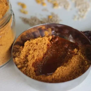 A bowl of Chennakunni Idli Podi/Chutney Powder mixed with ghee
